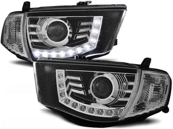 Scheinwerfer Set mit Tagfahrlichtoptik Mitsubishi L200 BJ 06-10 Klar Schwarz
